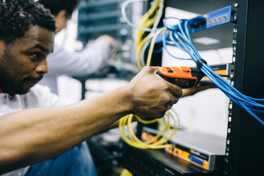 Two engineers working together on an electronics build