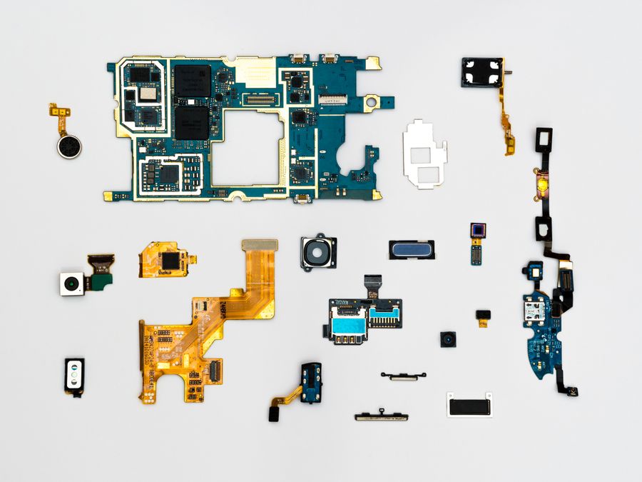 Prototype board with components laid out for a small-batch build